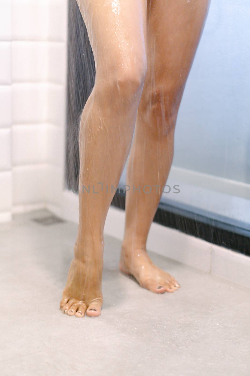 Close up woman legs with taking a shower in the bathroom, health care and beauty