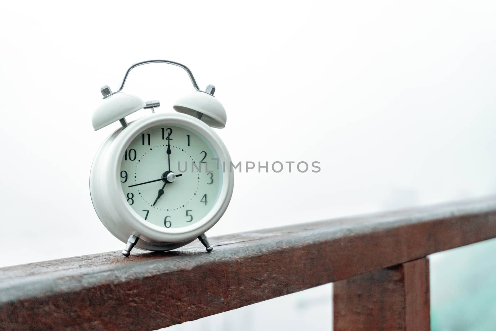Alarm clock with nature and fog background in the morning by pt.pongsak@gmail.com