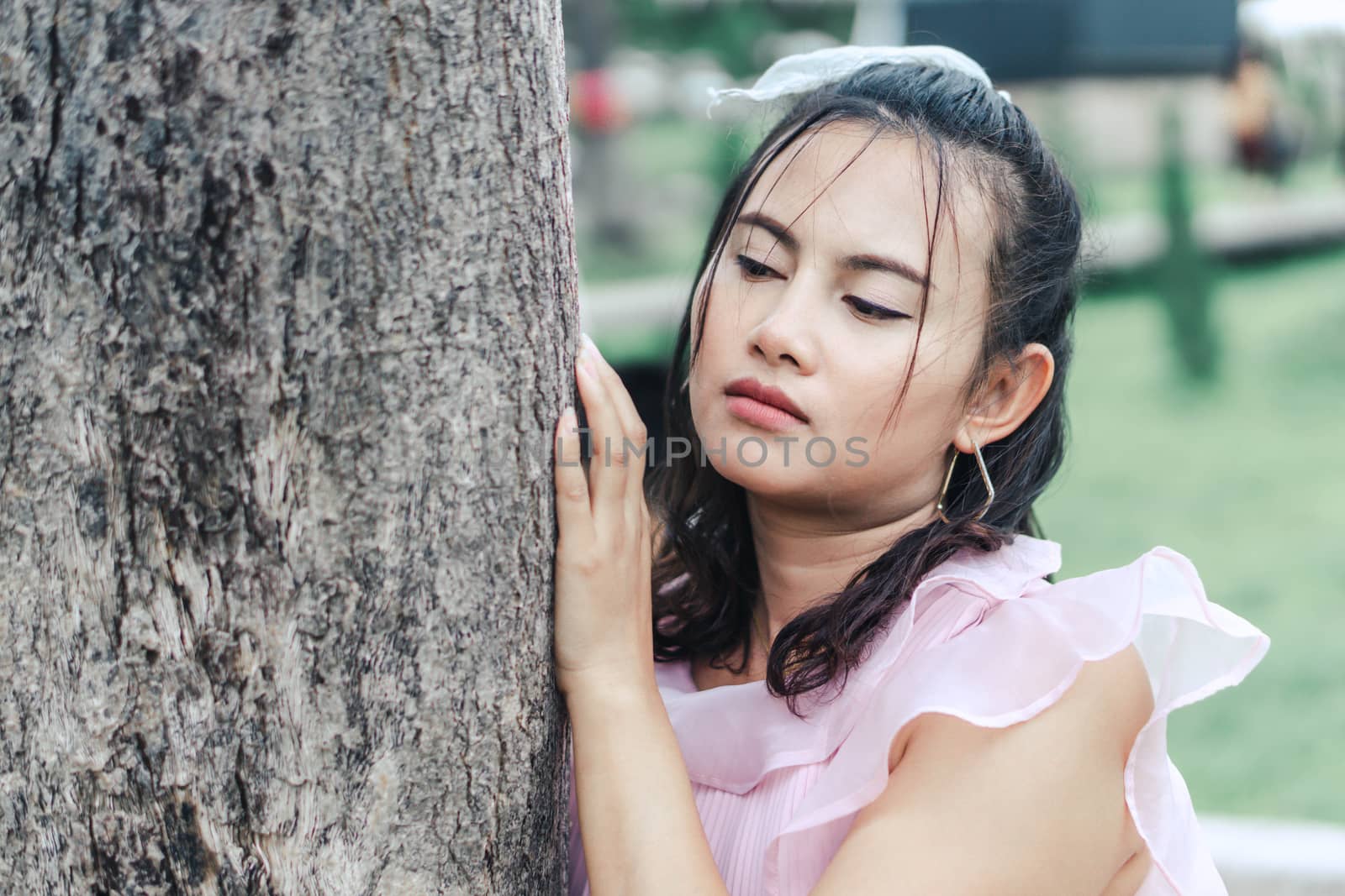 Portrait of asian happy woman smiling with nature garden , Selective focus