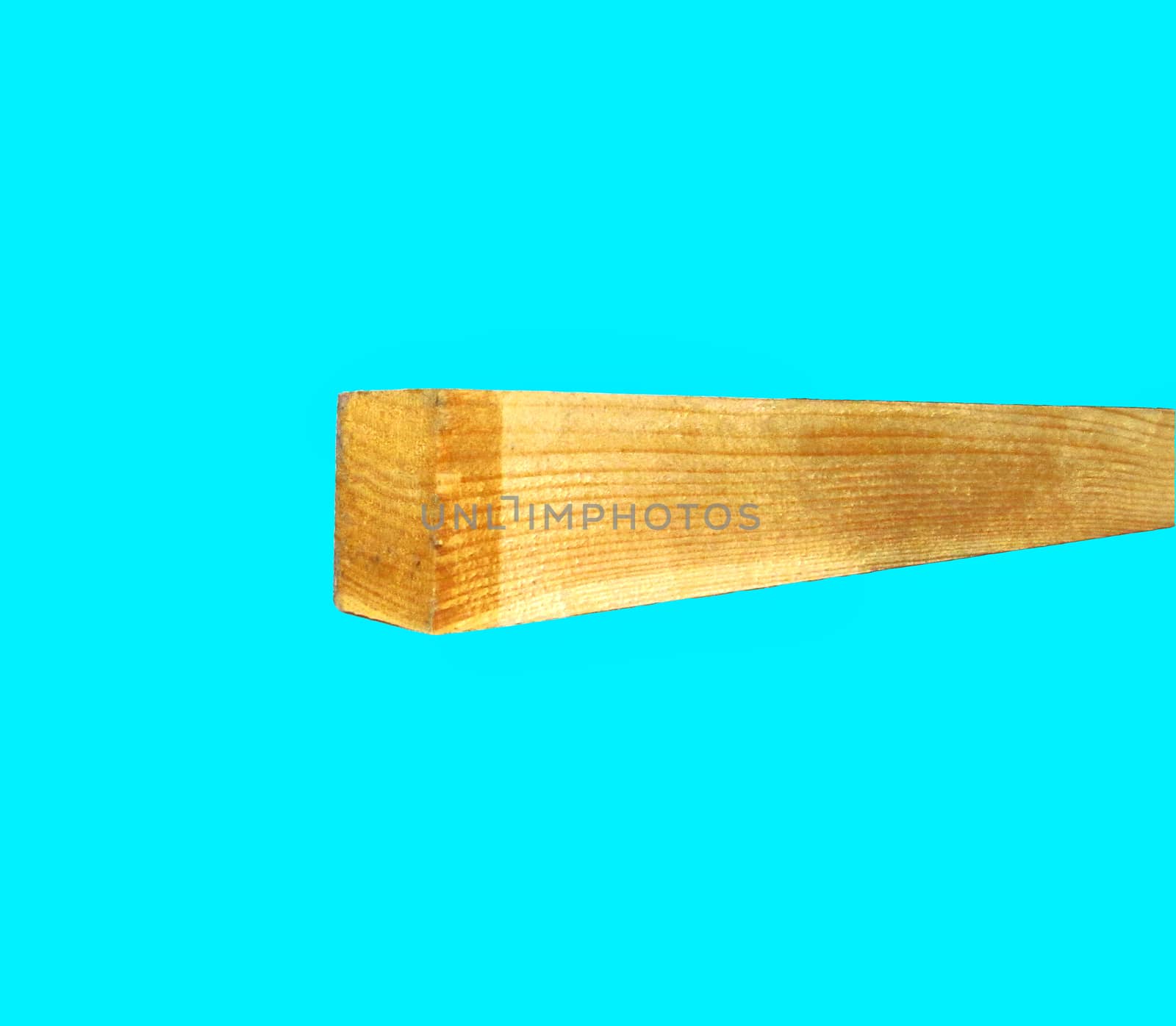 long wooden beam on a blue background as a material for furniture, construction and other finishing works