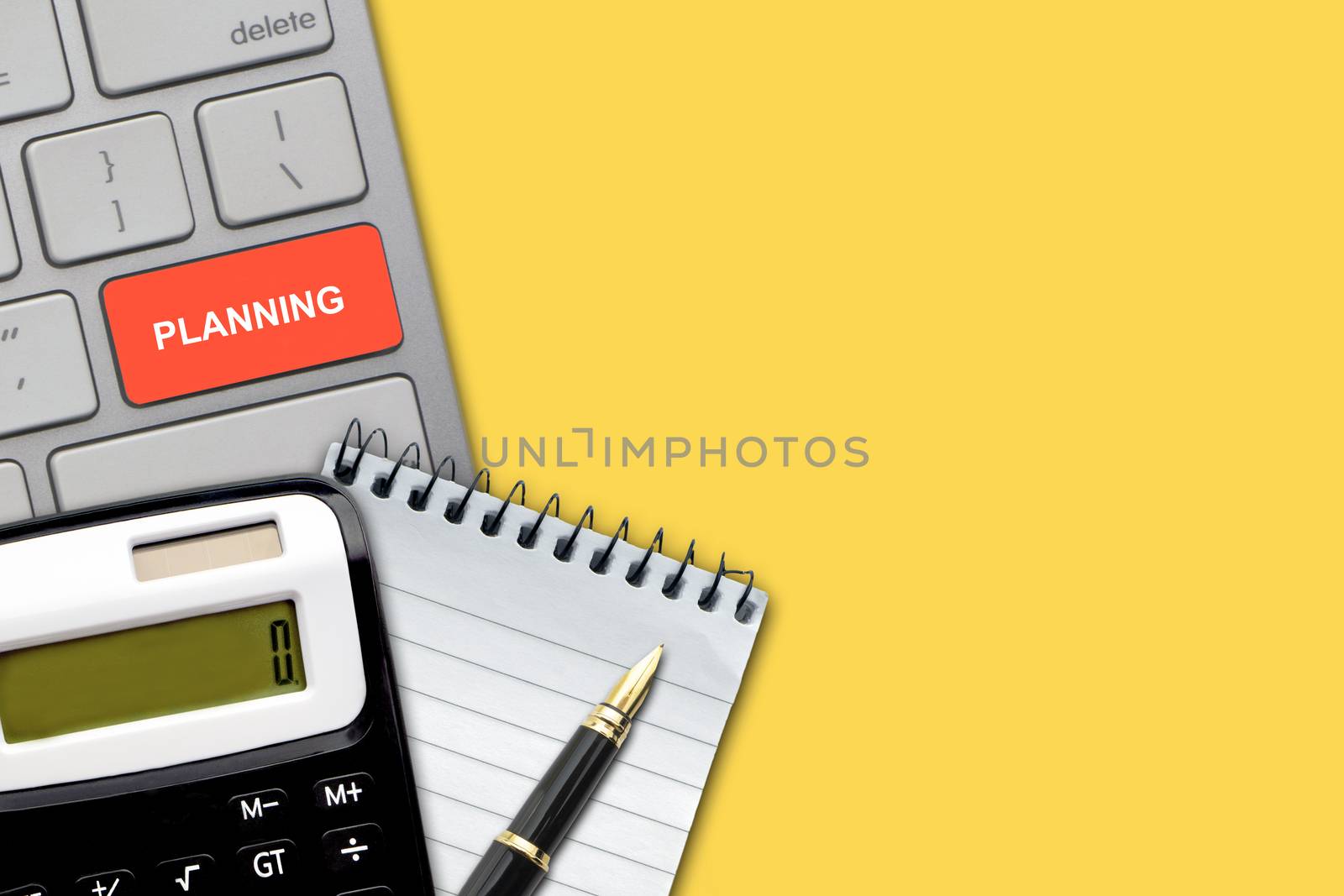 PLANNING text with pen, calculator, notepad and keyboard on the yellow background by silverwings
