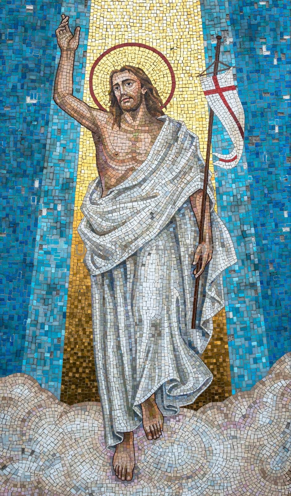 Full-length jesus mosaic with arms in prayer position. The painting is full of colors. It can be used for backgrounds, concepts and holidays.