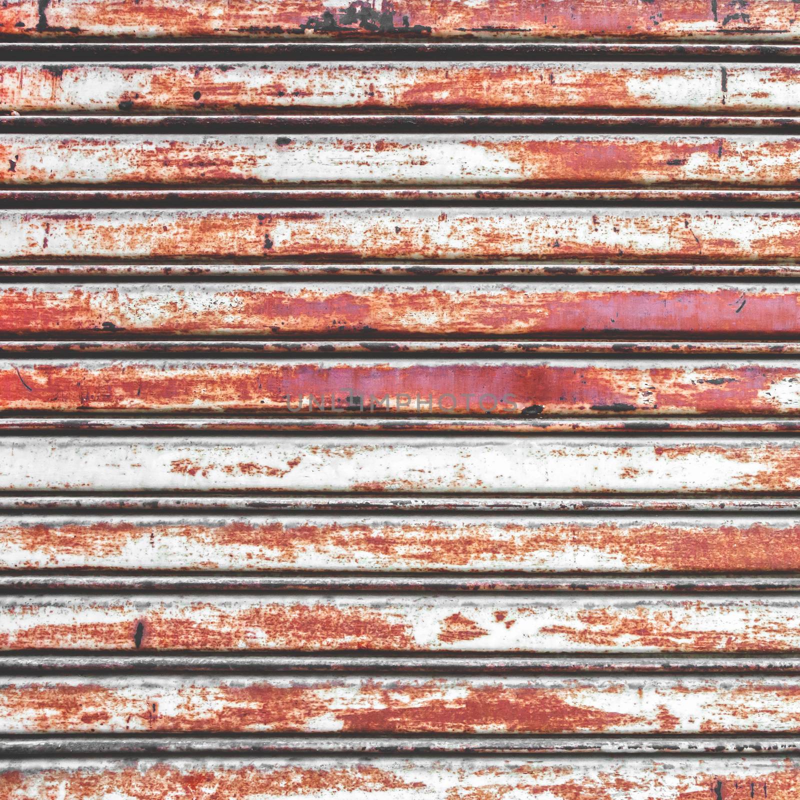 Close up of rusty shutters of a garage by germanopoli
