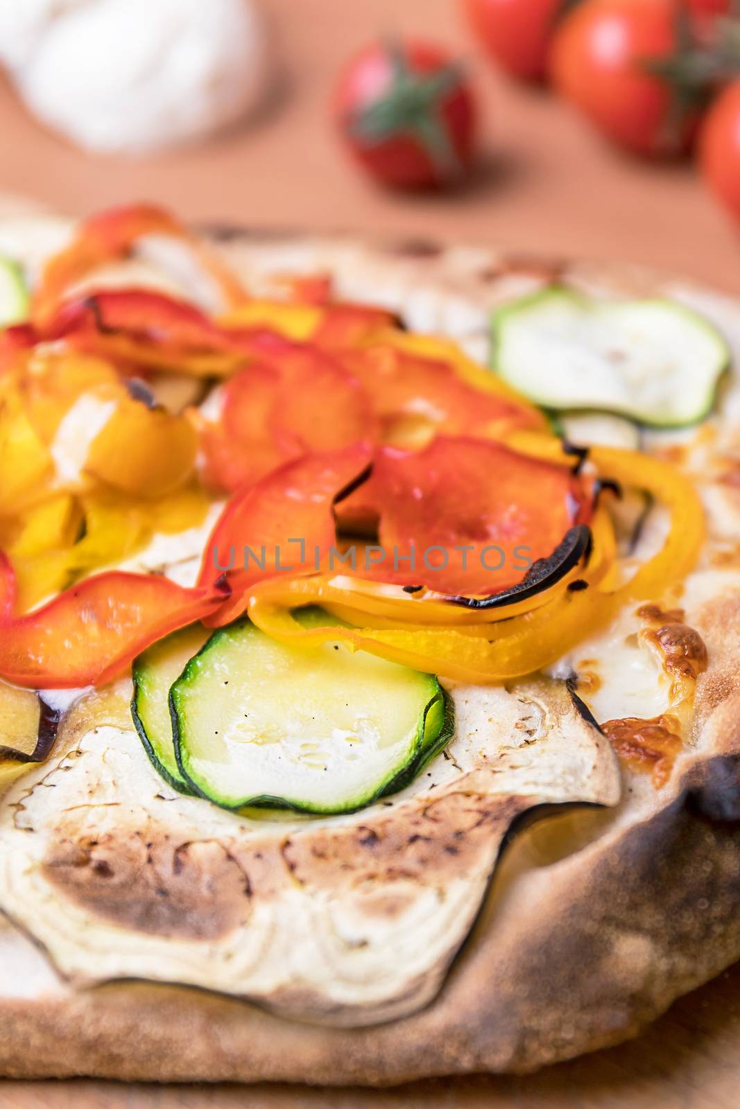 Fresh, veggie pizza with peppers, aubergines and grilled courgettes.