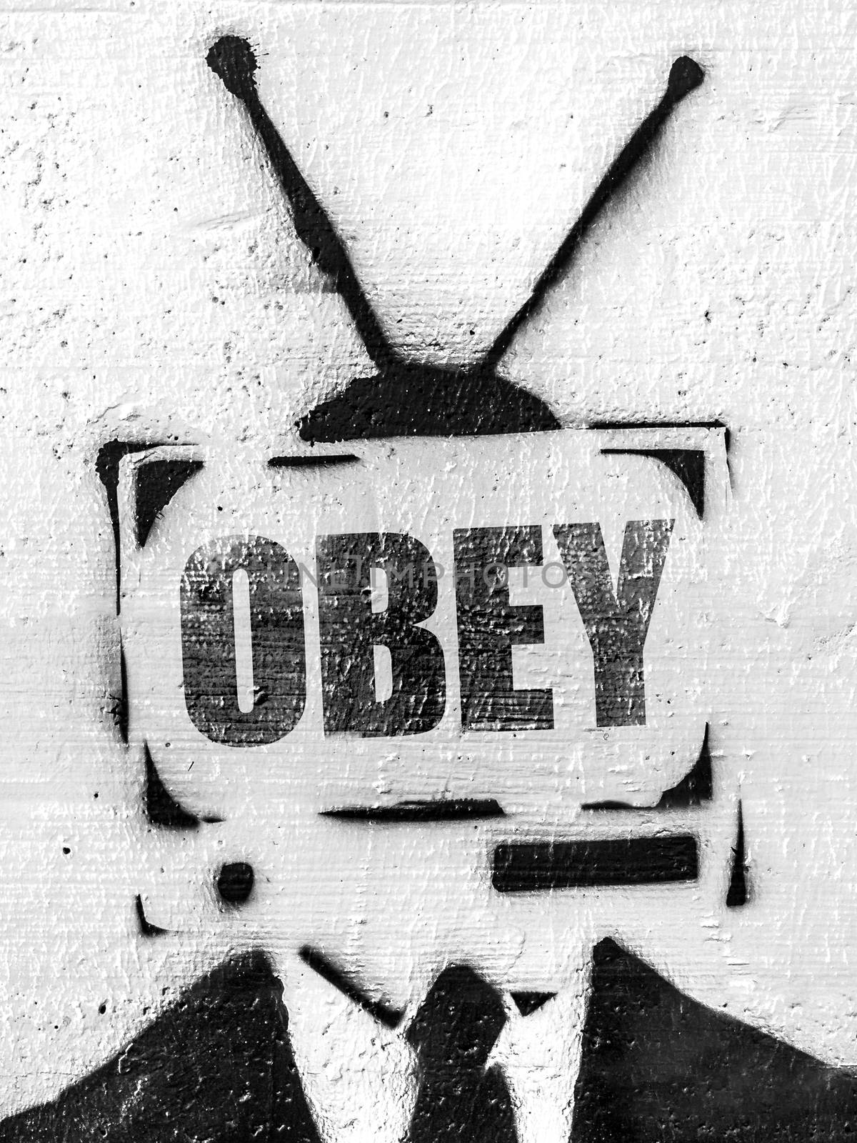 TV head with message OBEY by germanopoli
