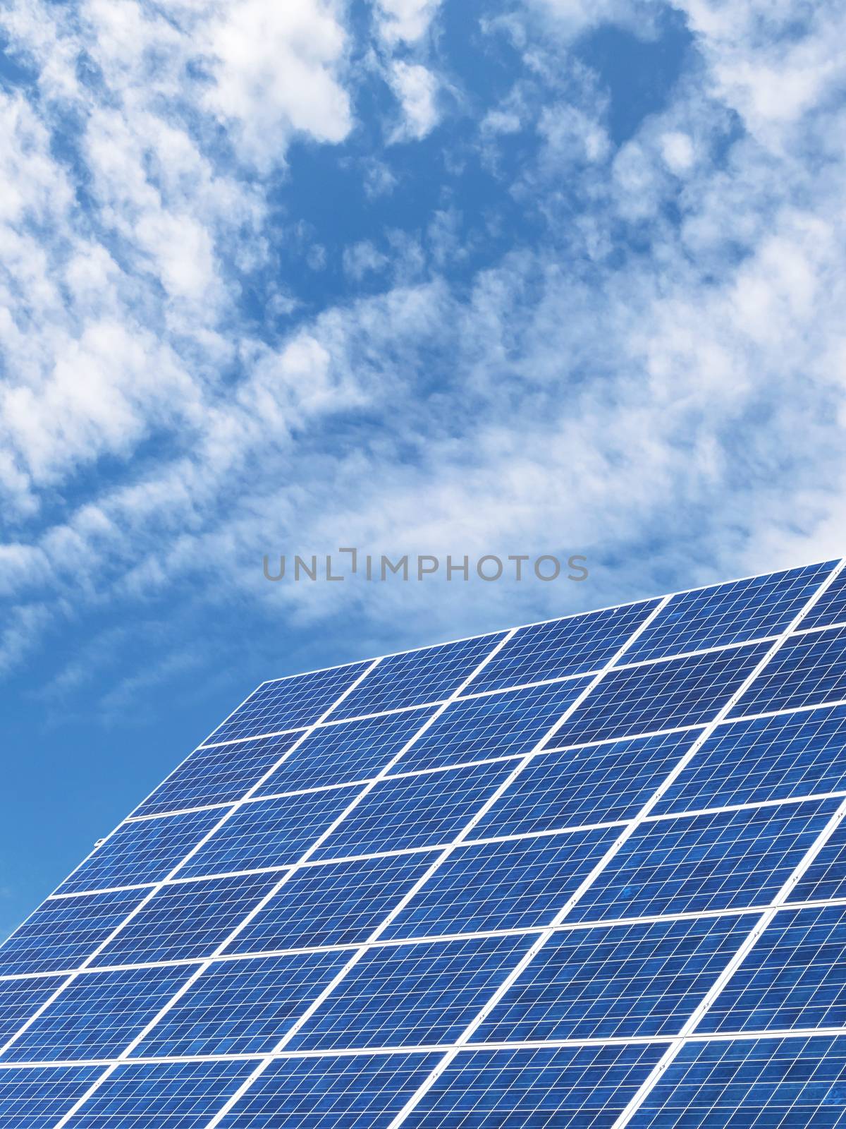 Solar panels for clean energy with a blue sky background. Copy space.