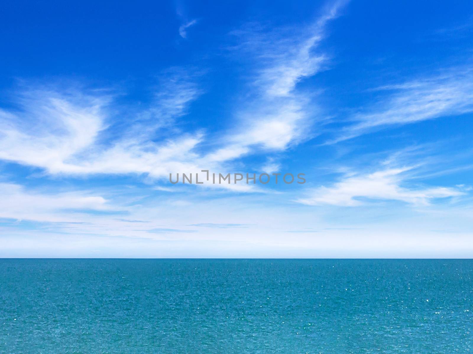 Calm sea and blue sky background. Metaphor to nature, peace, summer, travel, tropical, tourism, environment and holiday seascape.