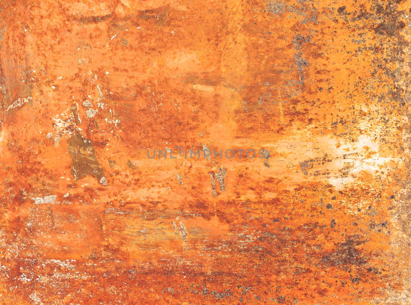 Rusty textured metal background. Grunge orange panel with oxidized or rusty marks produce a colorful painted surface that is full of texture and patterns.