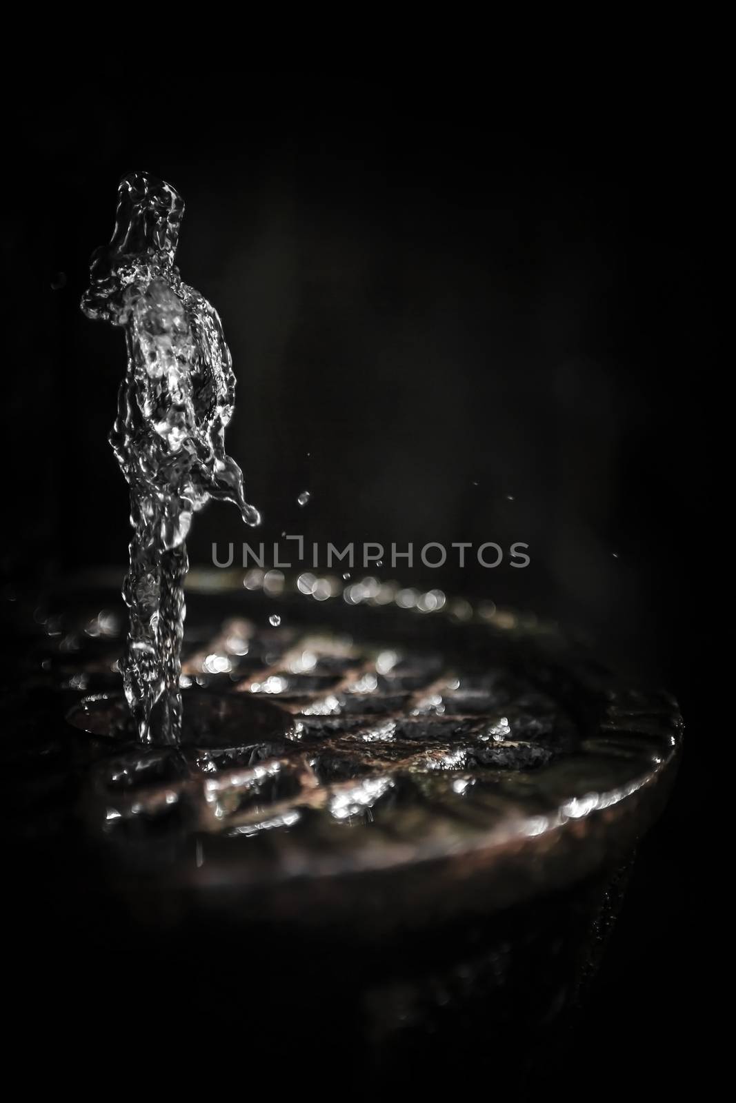 Water fountain jet creating a strange figure by germanopoli