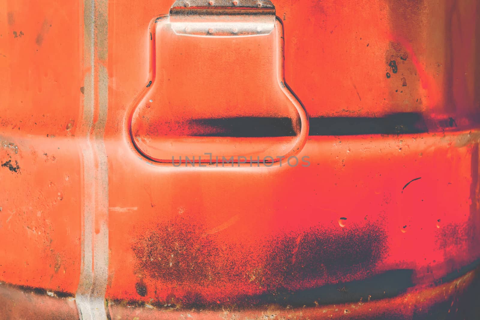 Red grunge color can. Metal can with red paint drips.