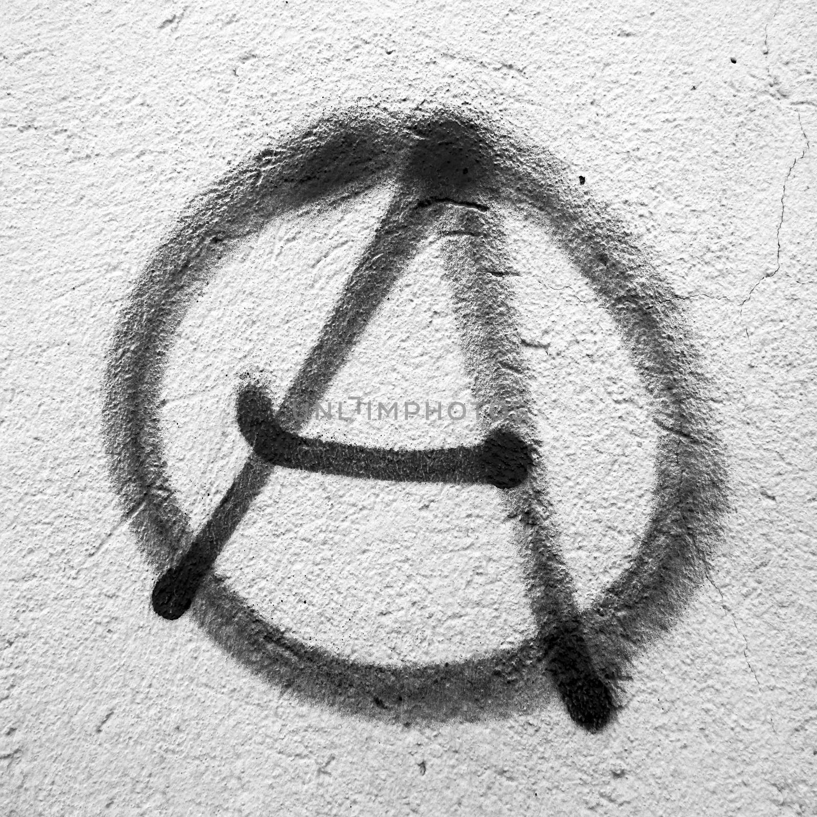 Anarchy symbol painted on wall by germanopoli