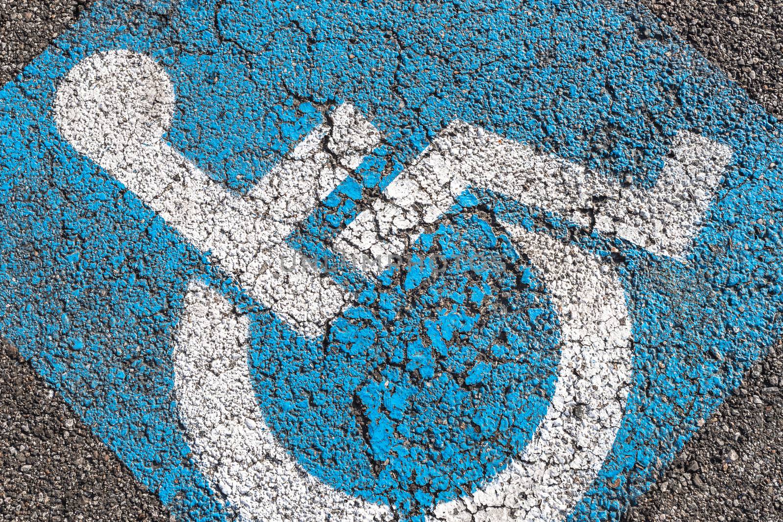Handicap parking sign painted on road space. For disabled or handicapped people.