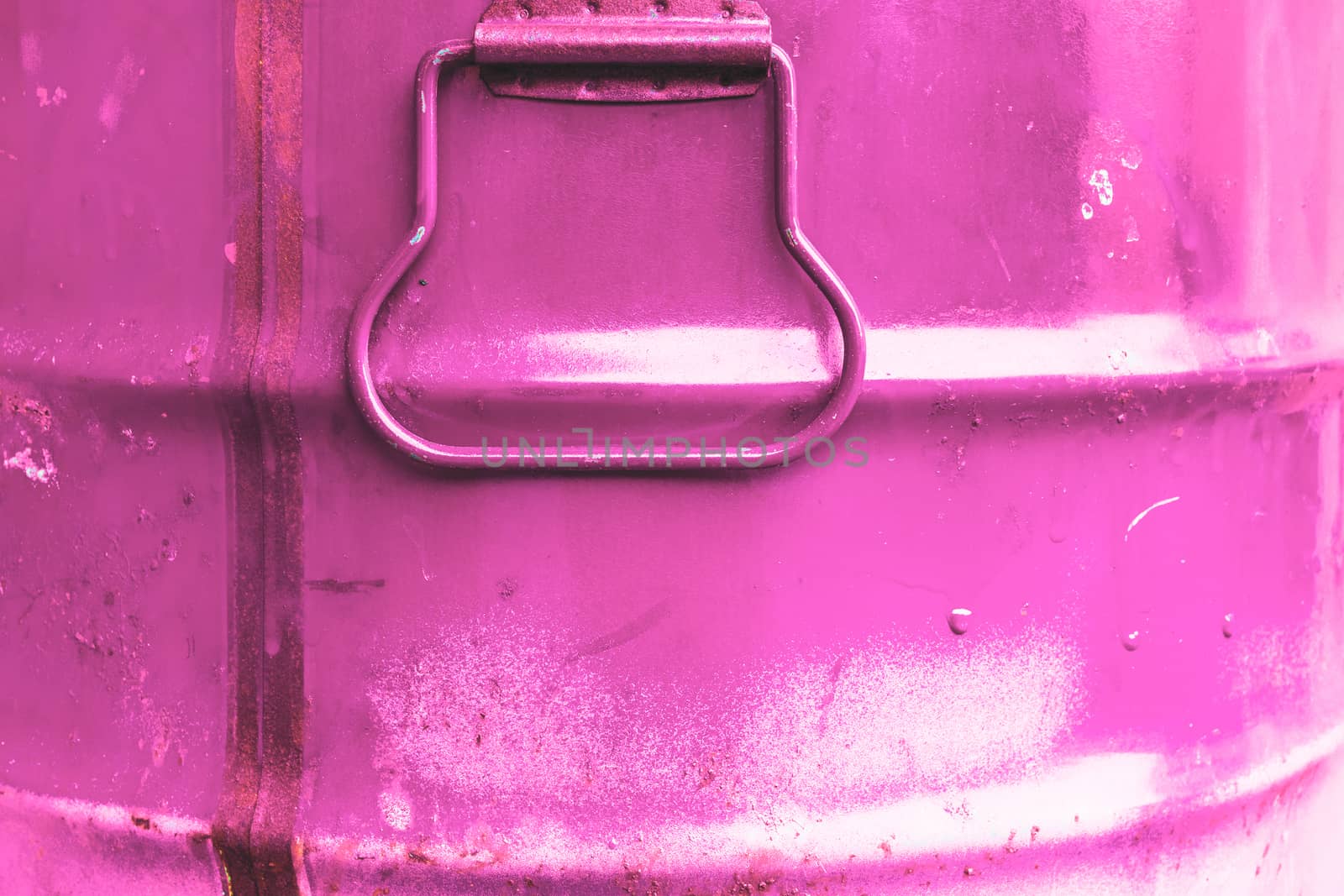 Pink color can. Metal can with pink paint drips.