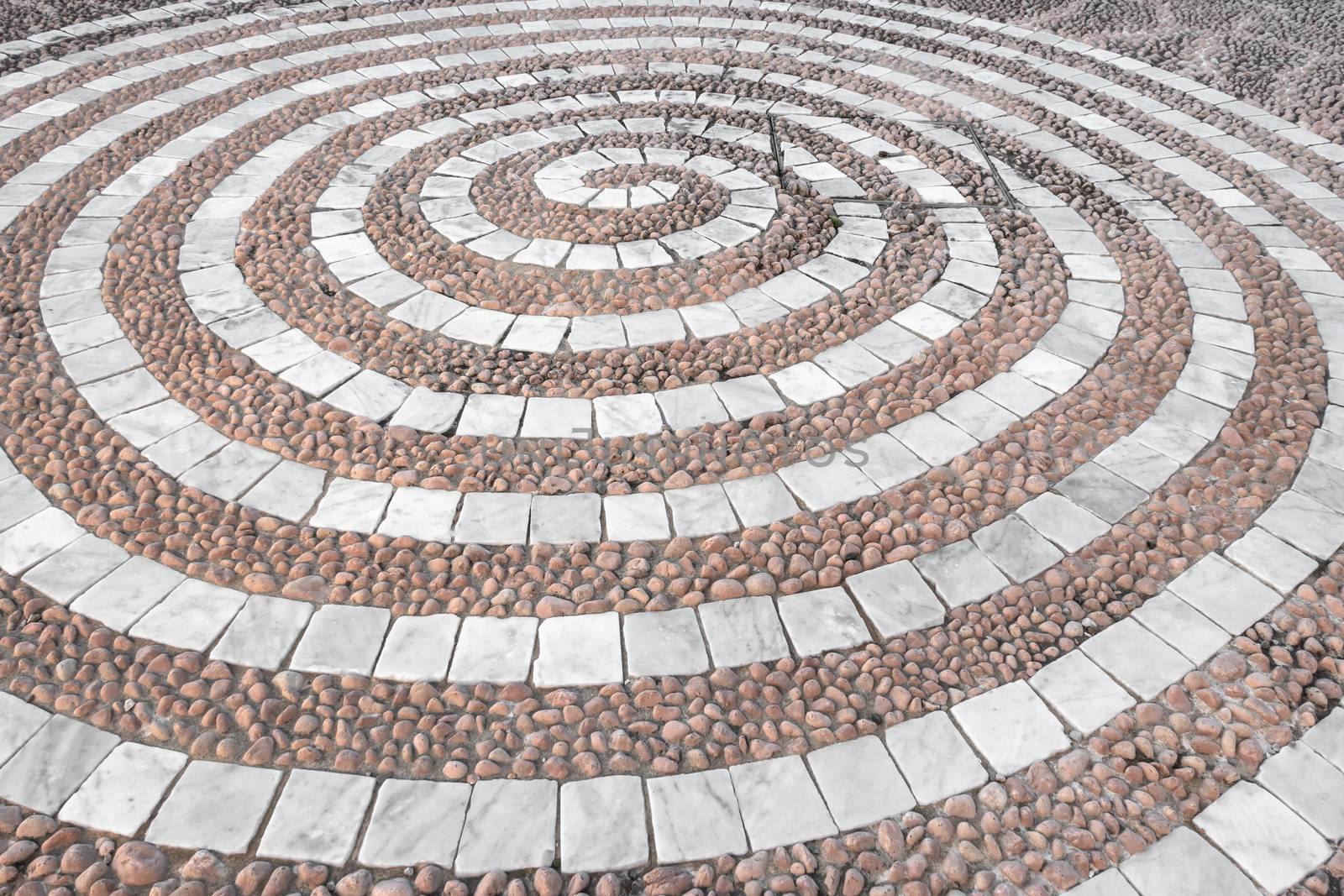 Pebbles mosaic floor with spiral pattern by germanopoli