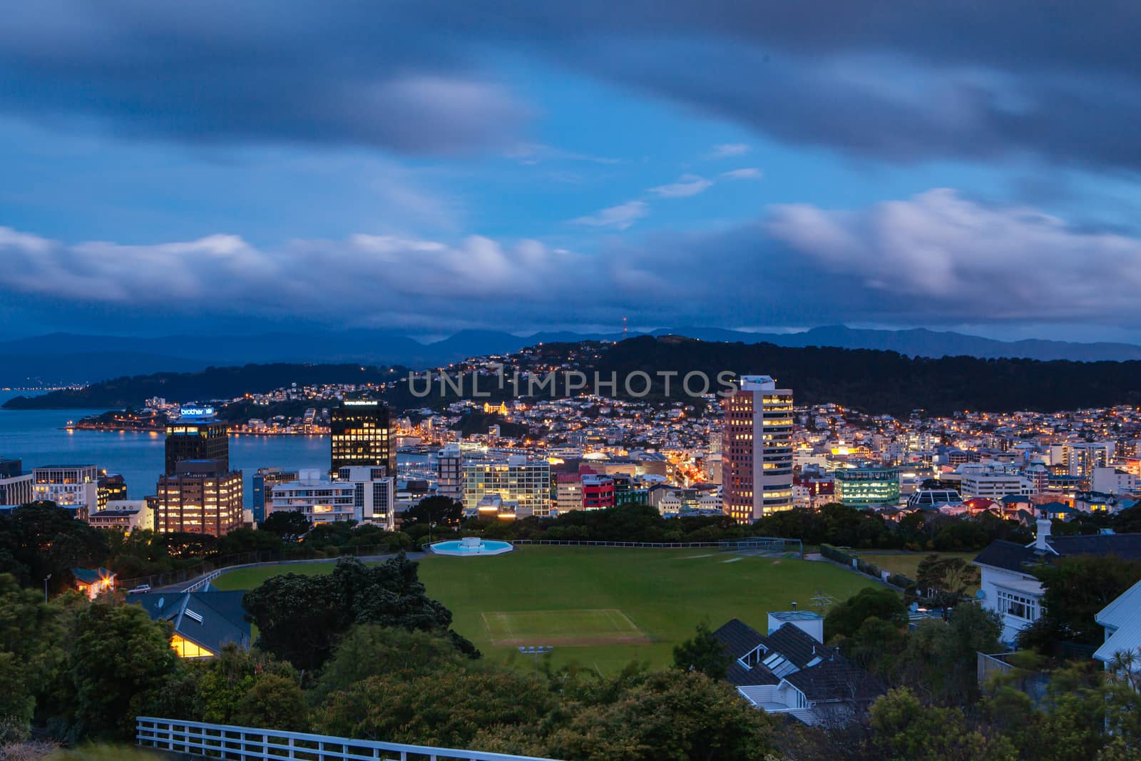 View over Wellington skyline and harbour at dusk from near Carter Observatory and Cable Car in Wellington, New Zealand