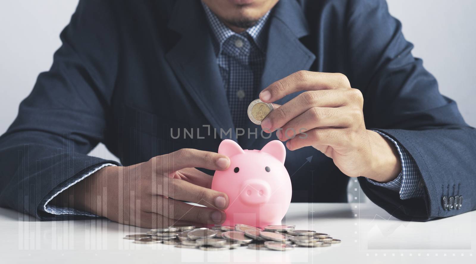 Hand of Business man holding coin put in piggy bank with money stack growing growth saving money, Concept invesment for financial freedom plan, business deposit to hope success 