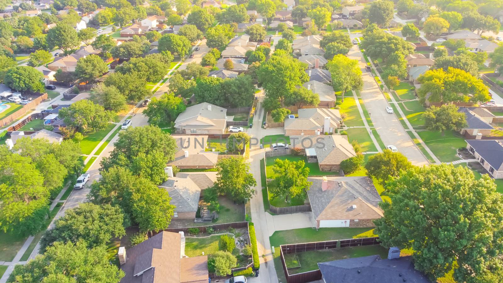 Bird eye view clean and peaceful neighborhood streets with row of single family homes near Dallas, Texas, USA by trongnguyen