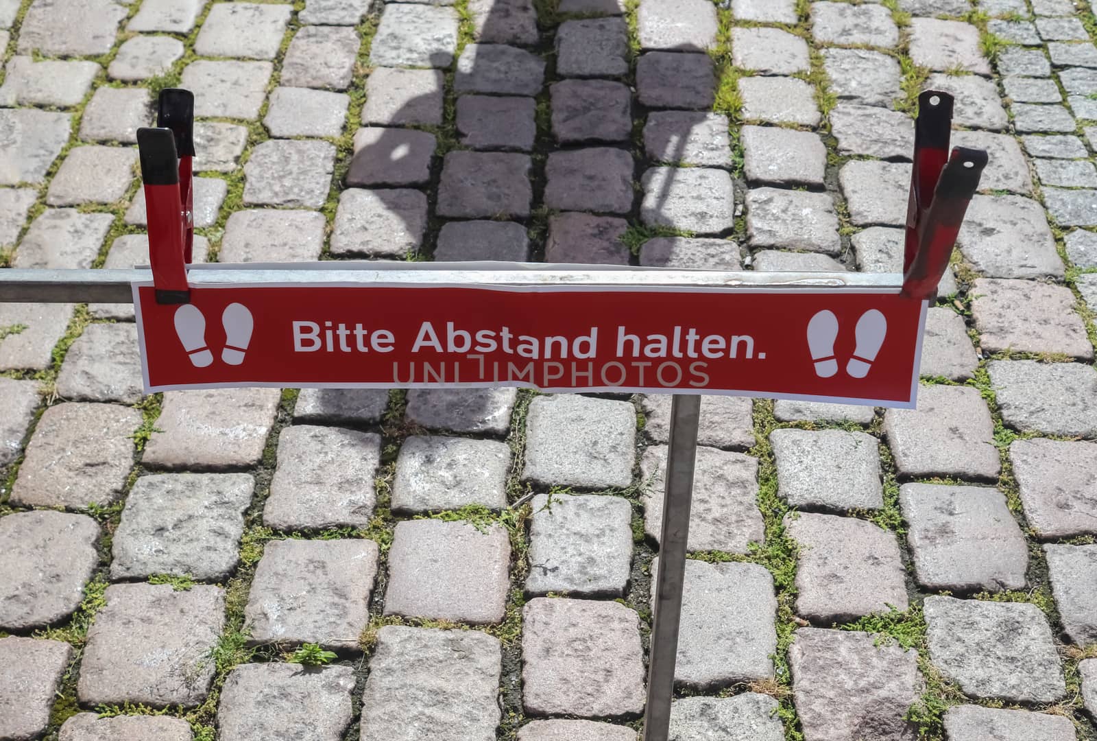Bitte Abstand Halten! 1.5 meter social distancing sign for COVID-19. Keep distance symbol in german language