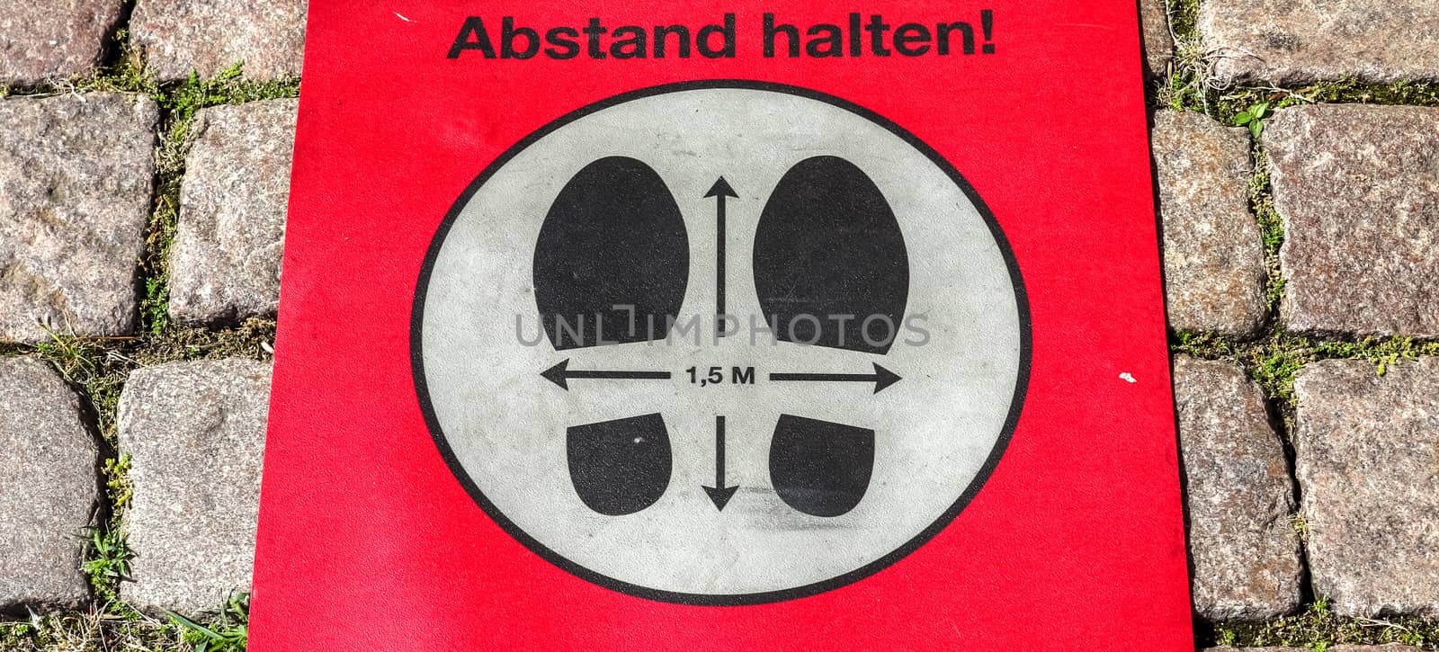 Bitte Abstand Halten! 1.5 meter social distancing sign for COVID-19. Keep distance symbol in german language