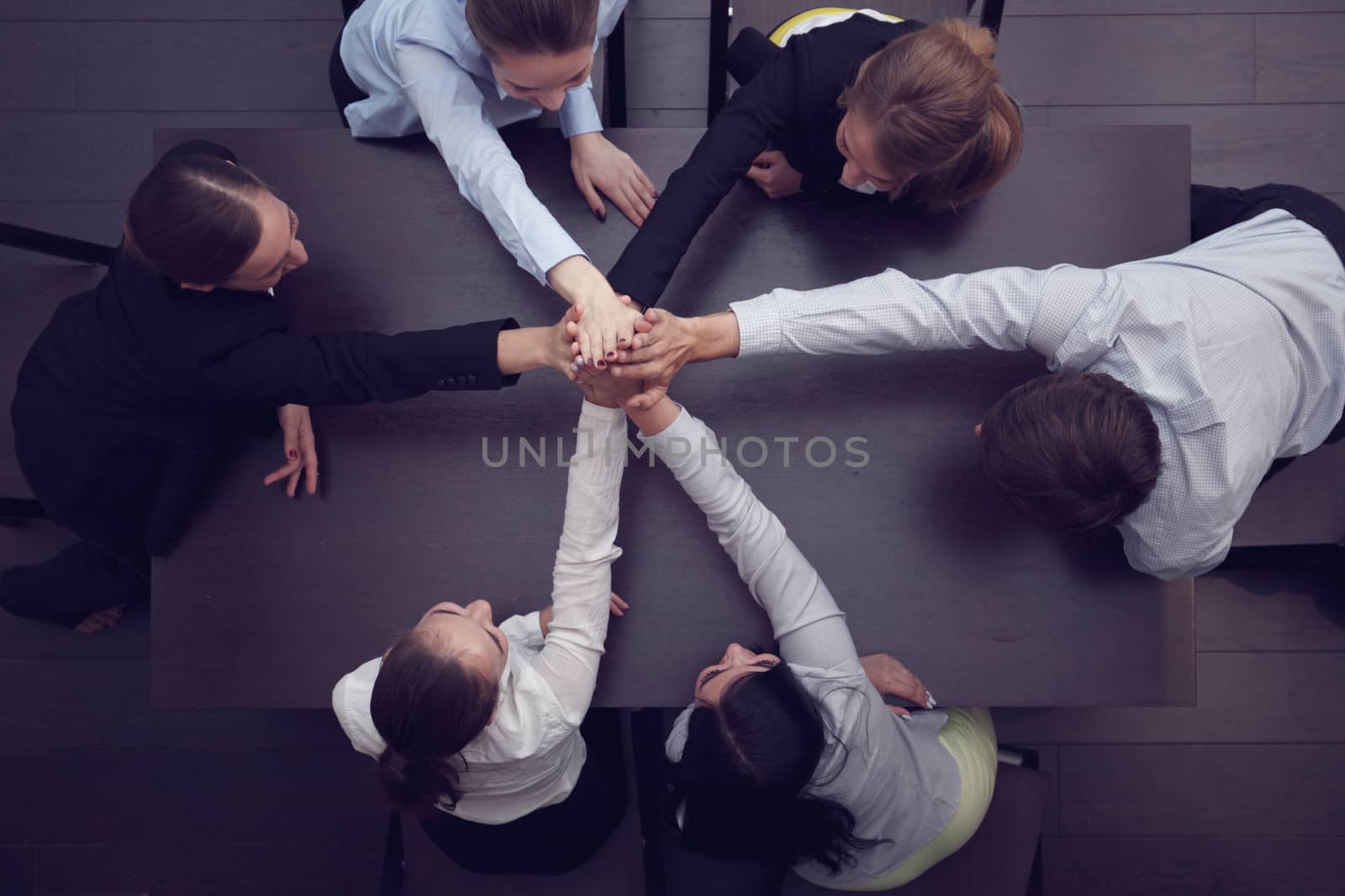 People with their hands together. Business team work concept