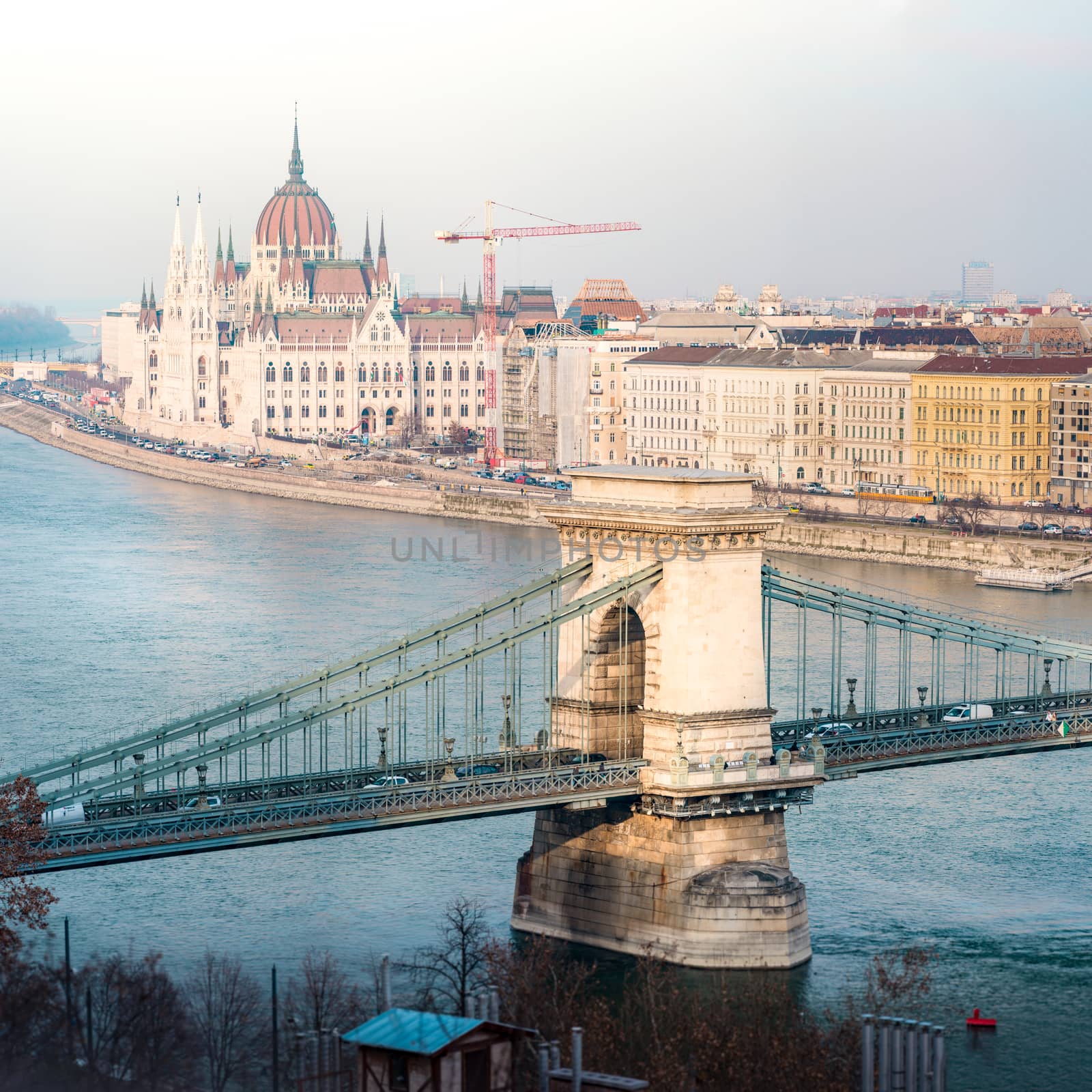 Parliament building and Chain Bridge in Budapest, Hungary, Europe. Blue water of Danube river. Major Landmark and tourist attraction.