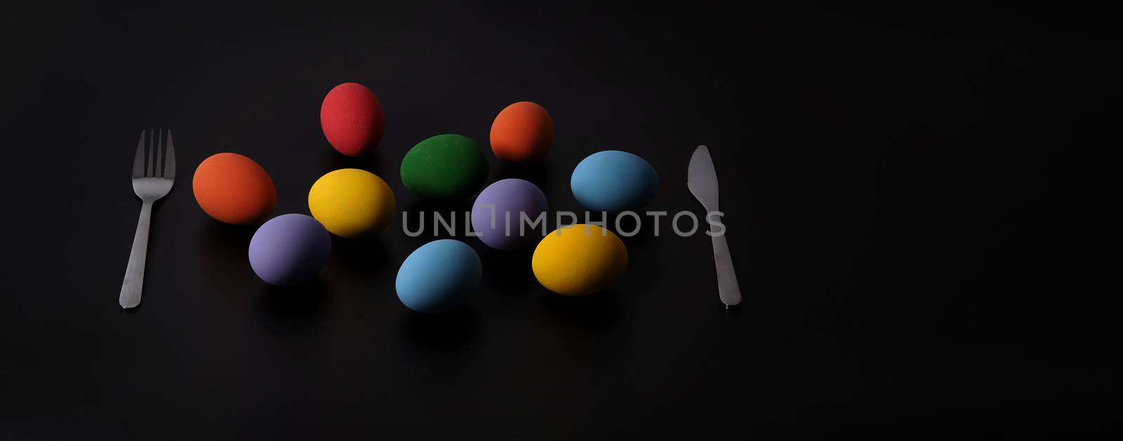 Multi-colorful of easter eggs on background in studio with close by gnepphoto