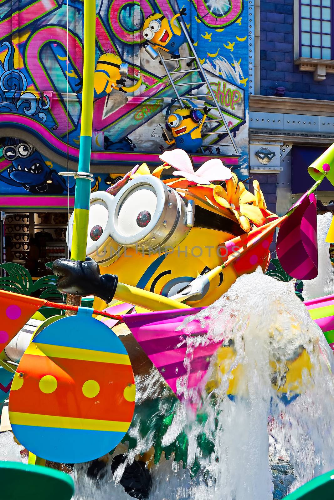 OSAKA, JAPAN - June 17, 2020 : Statue of HAPPY MINION easter version in Universal Studios Japan.Minions are famous character from Despicable Me animation.Universal Studios Japan reopening after COVID-19 quarantine.