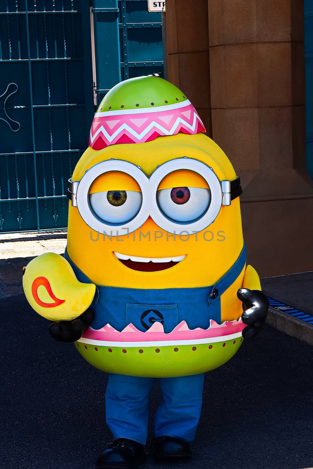 OSAKA, JAPAN - June 17, 2020 : Statue of HAPPY MINION easter version in Universal Studios Japan.Minions are famous character from Despicable Me animation.Universal Studios Japan reopening after COVID-19 quarantine. by USA-TARO