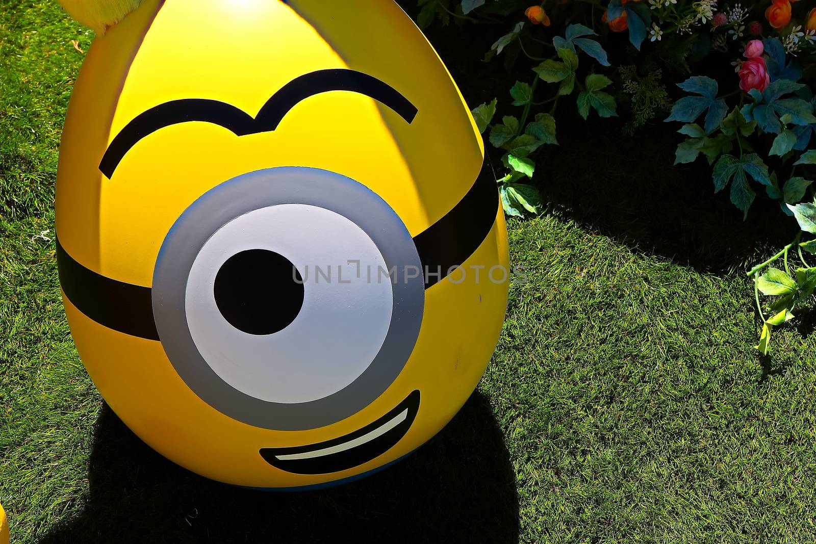 OSAKA, JAPAN - June 17, 2020 : Statue of HAPPY MINION easter version in Universal Studios Japan.Minions are famous character from Despicable Me animation.Universal Studios Japan reopening after COVID-19 quarantine.