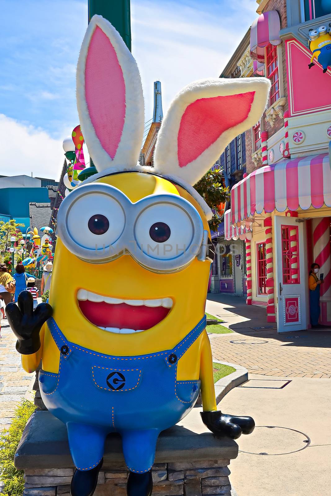 OSAKA, JAPAN - June 17, 2020 : Statue of HAPPY MINION easter version in Universal Studios Japan.Minions are famous character from Despicable Me animation.Universal Studios Japan reopening after COVID-19 quarantine. by USA-TARO