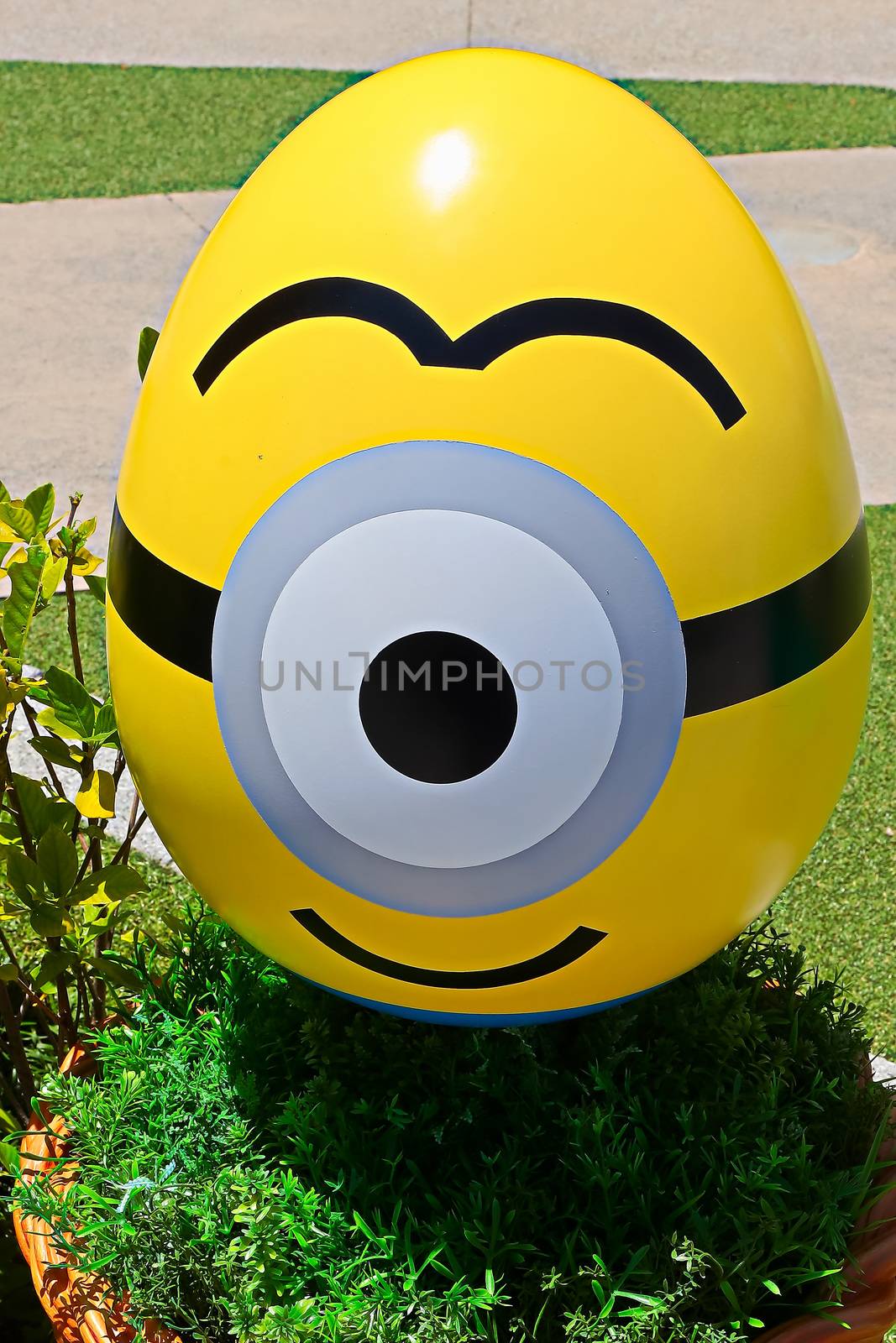 OSAKA, JAPAN - June 17, 2020 : Statue of HAPPY MINION easter version in Universal Studios Japan.Minions are famous character from Despicable Me animation.Universal Studios Japan reopening after COVID-19 quarantine.