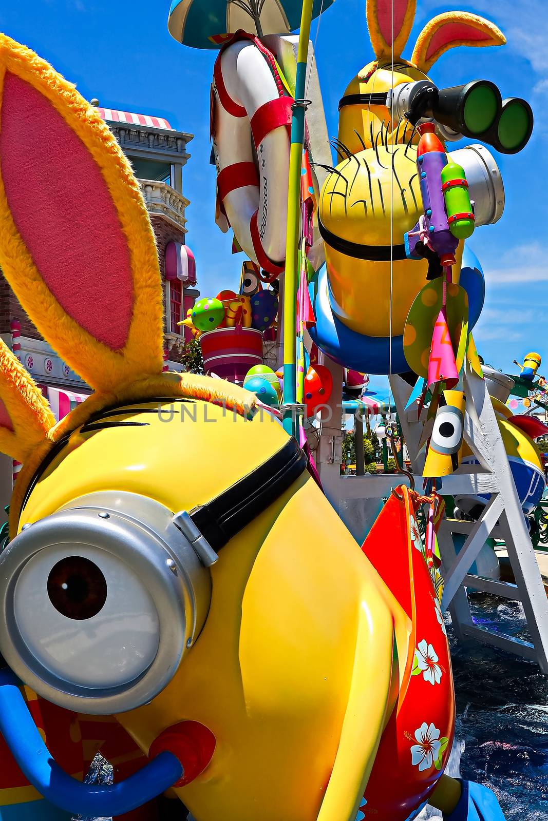 OSAKA, JAPAN - June 17, 2020 : Statue of HAPPY MINION easter version in Universal Studios Japan.Minions are famous character from Despicable Me animation.Universal Studios Japan reopening after COVID-19 quarantine. by USA-TARO