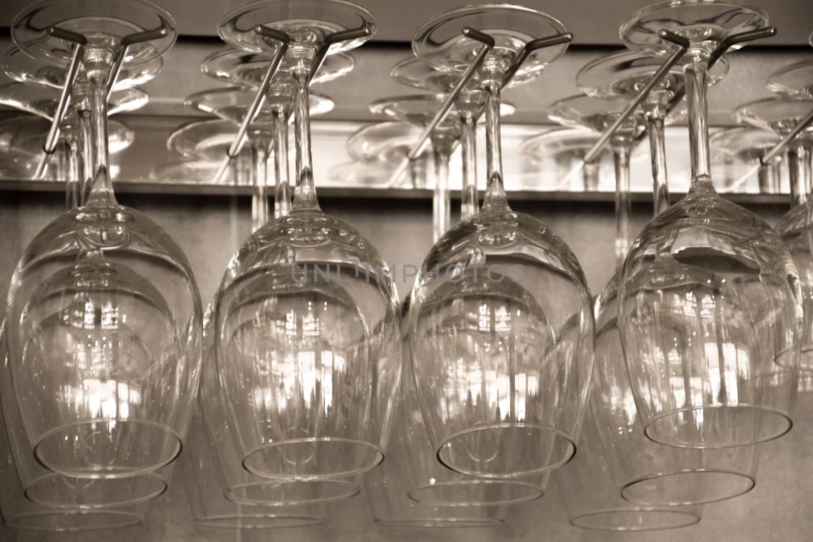 Glass cups hung upside down by Joanastockfoto