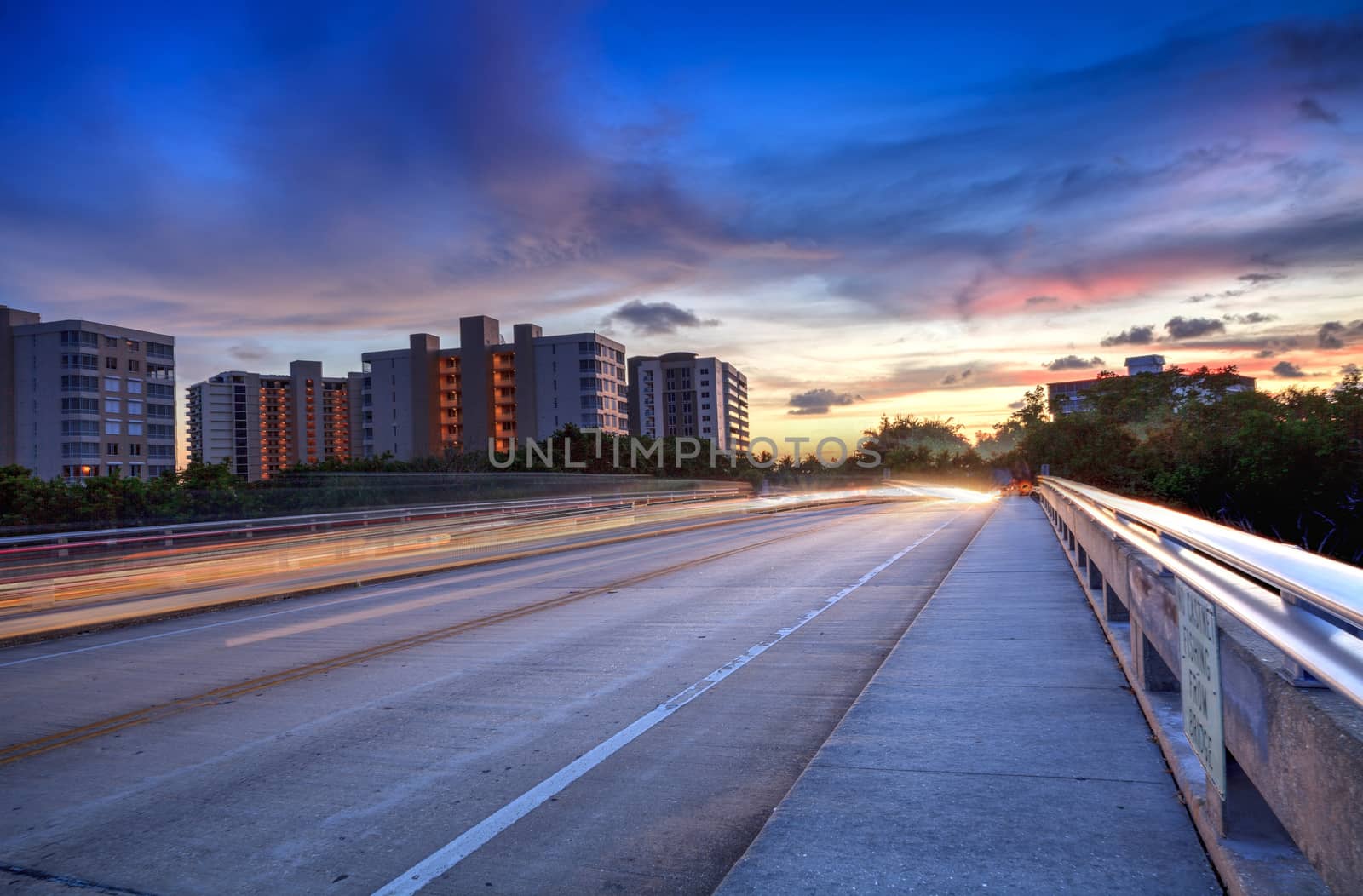 Light trails on the Overpass of Bluebill Avenue leading toward D by steffstarr