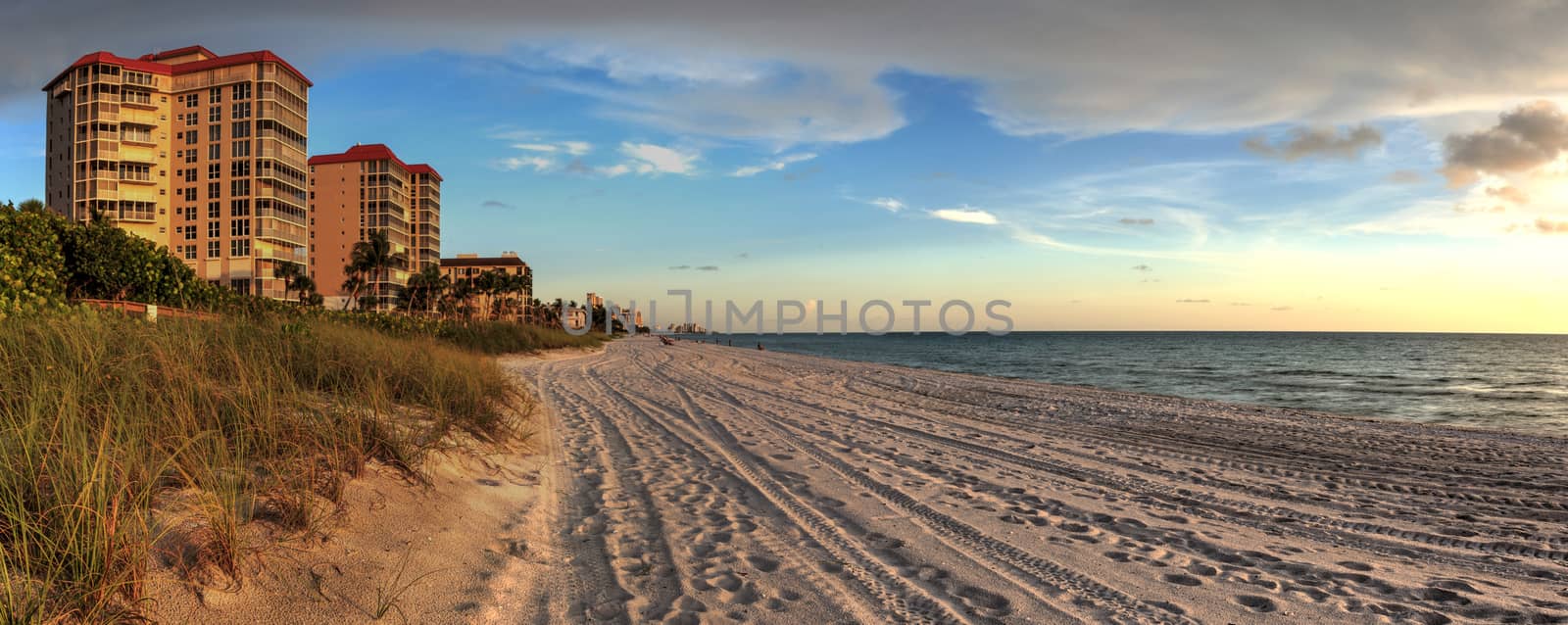 Sunset over white sand at Delnor Wiggins State Park in Naples, Florida.
