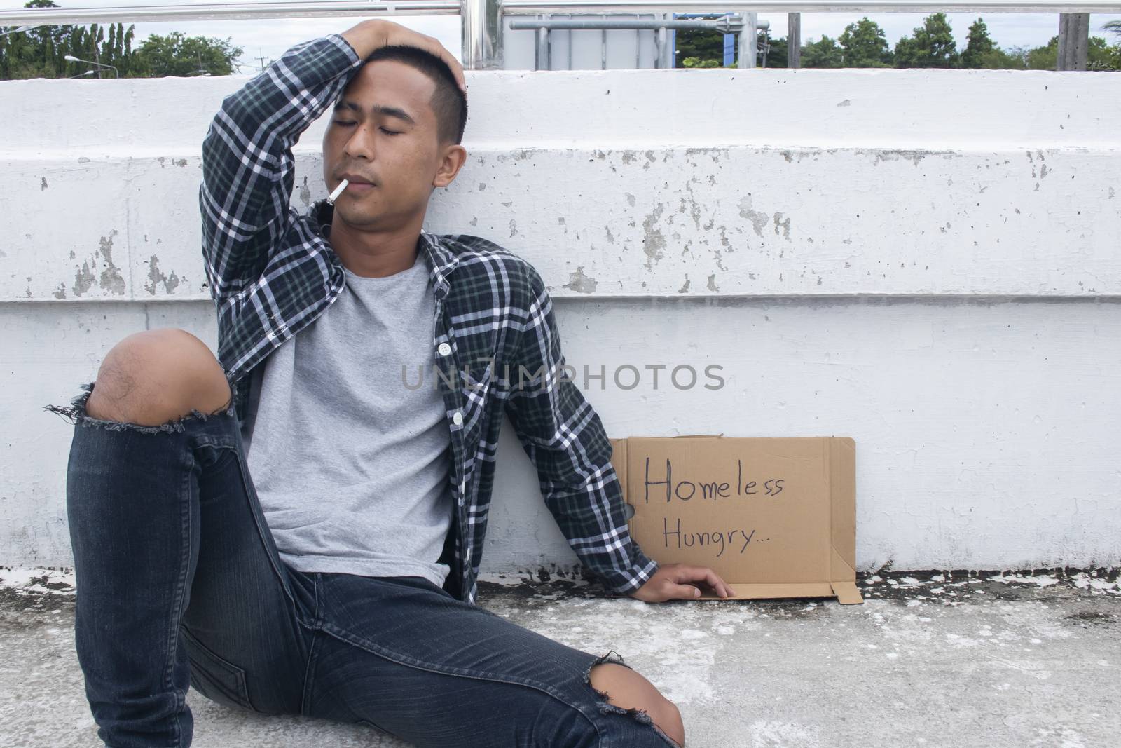Homeless man smoking.Unhappy homeless man by Gobba17