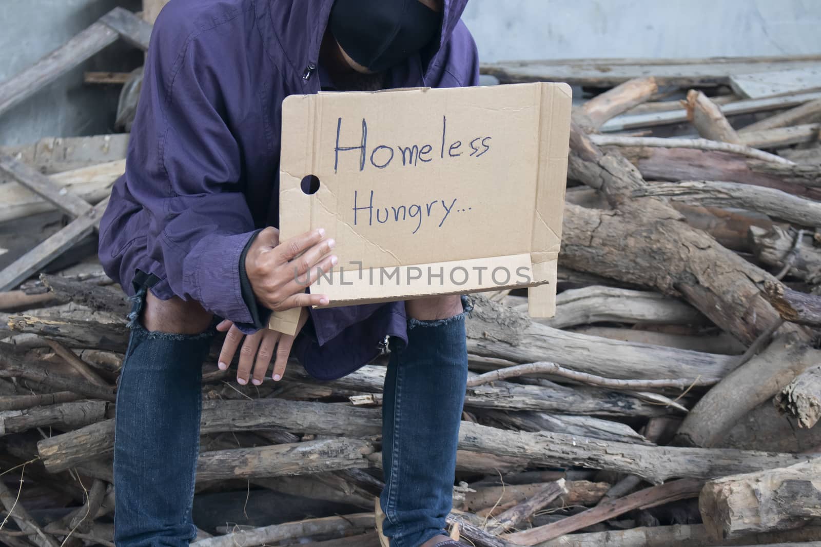 Close-up of homeless and hungry street person asking for help 