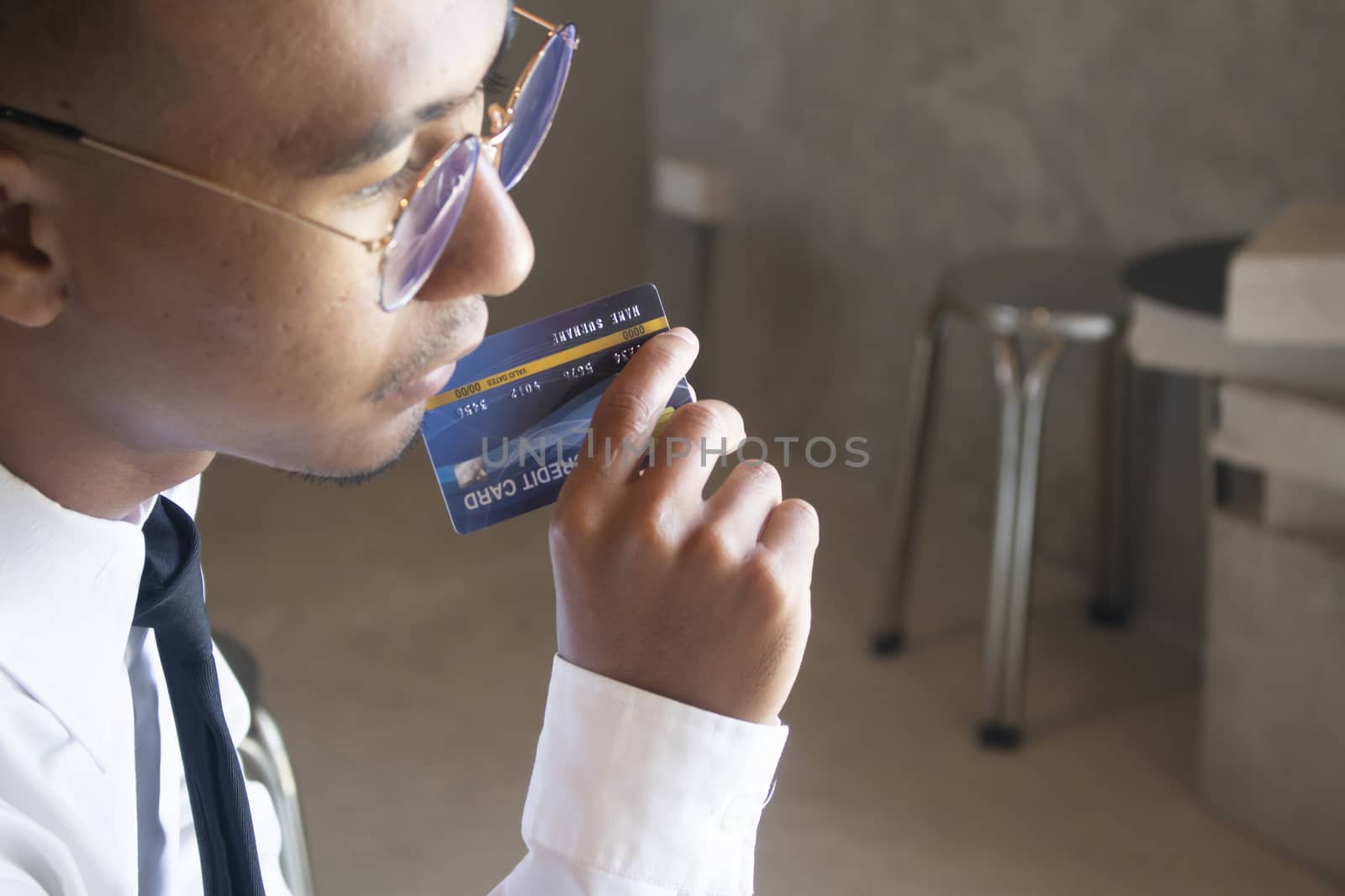 Asian business man holding cradit card