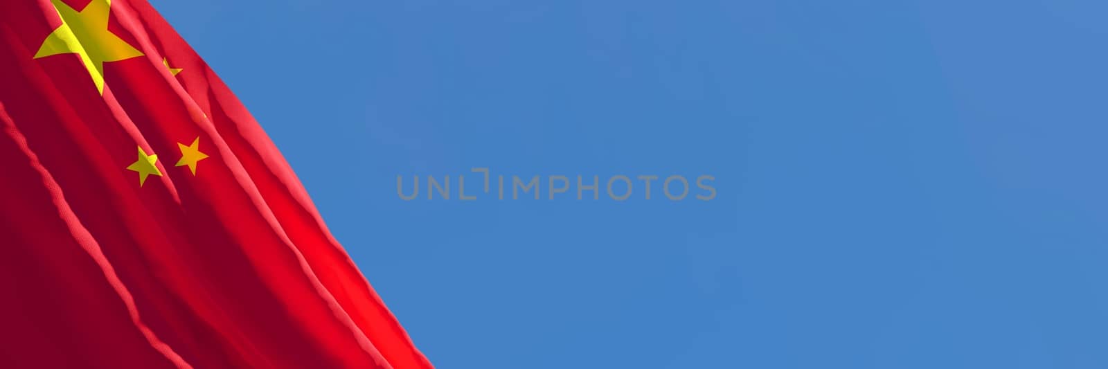 3D rendering of the national flag of China waving in the wind against a blue sky