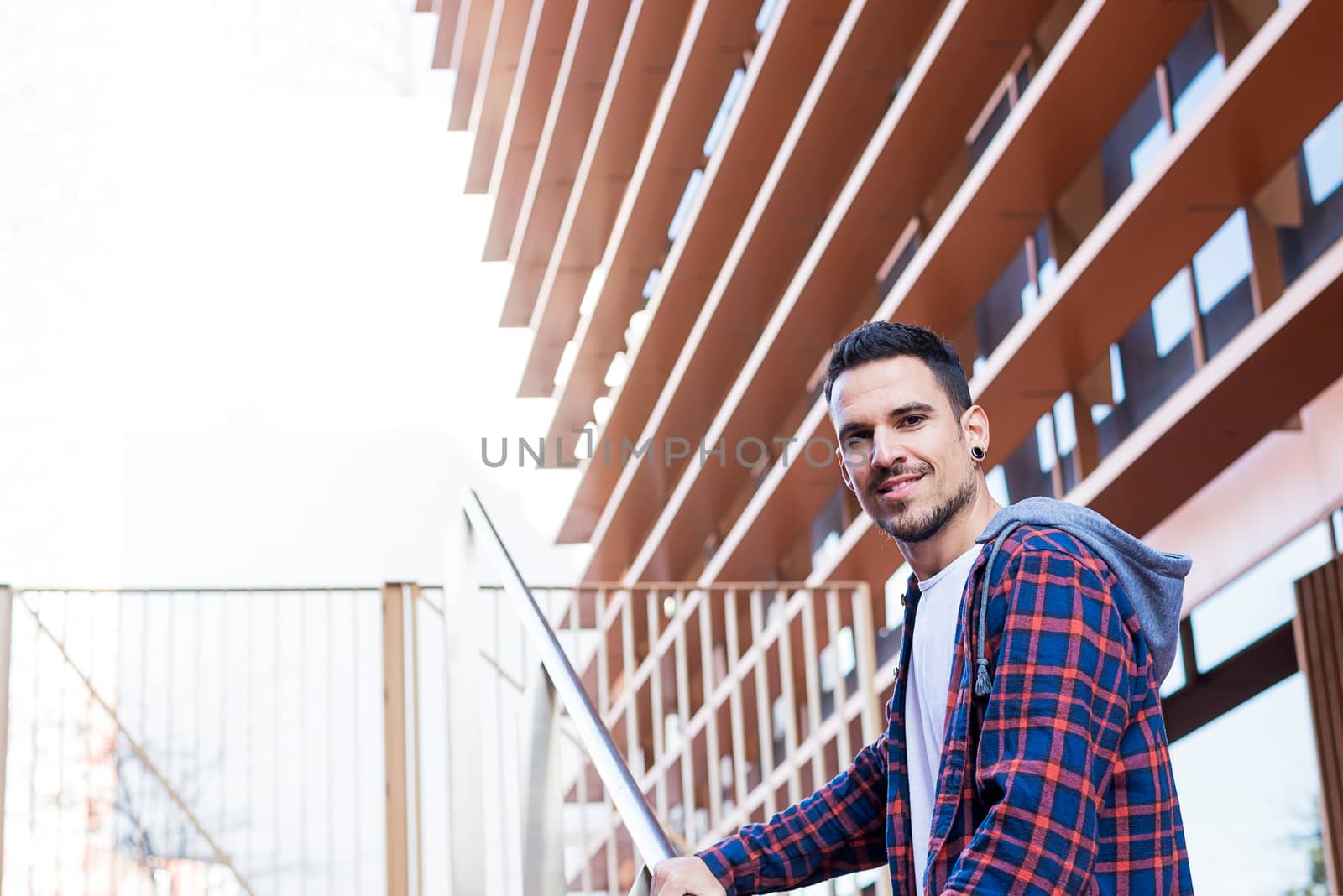 Portrait of smiling stubble male at outdoors