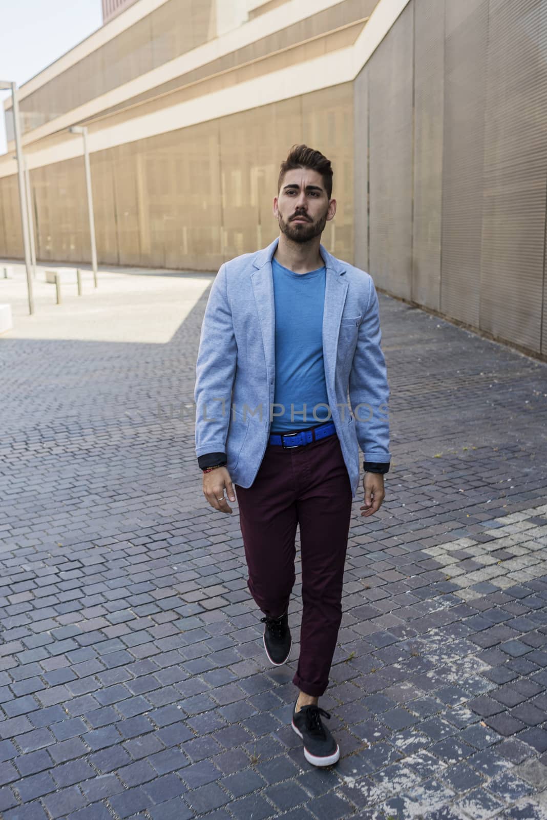 Young bearded man, model of fashion, in urban background wearing casual clothes. by raferto1973