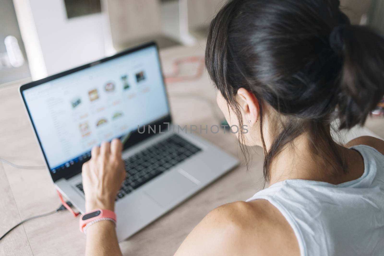 Woman with laptop working at home