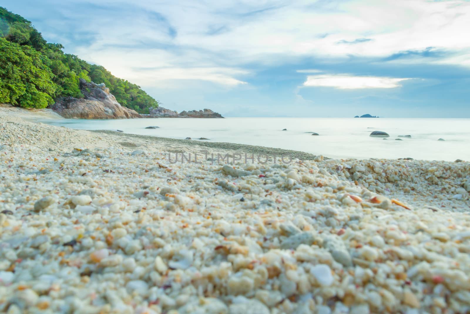 Peaceful and tropical coral turtle beach at Perhentian Islands, Malaysia, long exposure, with cloudy sky during sunset by kb79