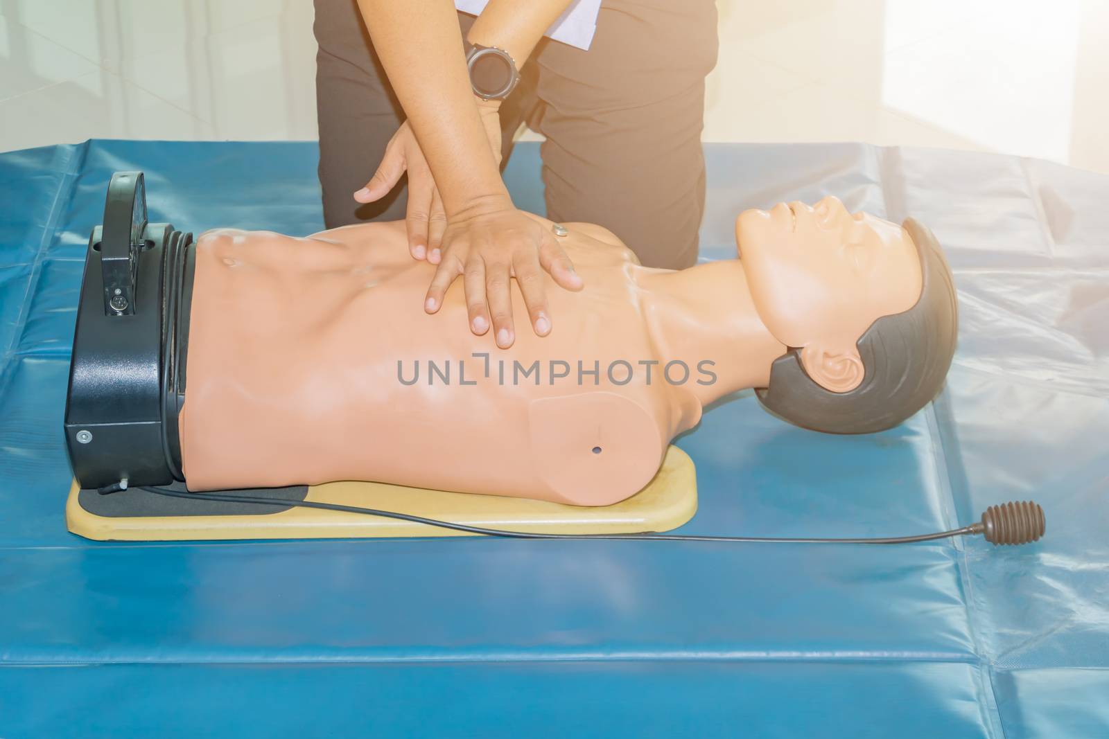 CPR aid dummy medical training with hand press Heart by pramot