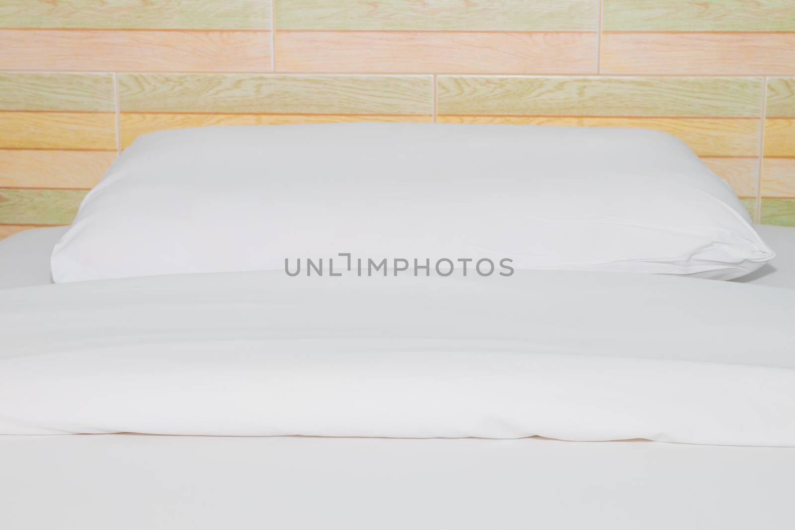 bed and  bedspread pillow white in in bedroom