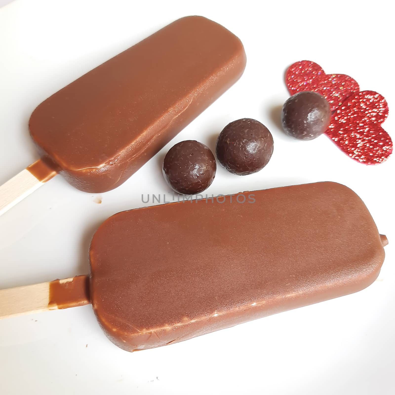 Delicious two chocolate icecream bar with chocolate ball in white plate plated beautifully