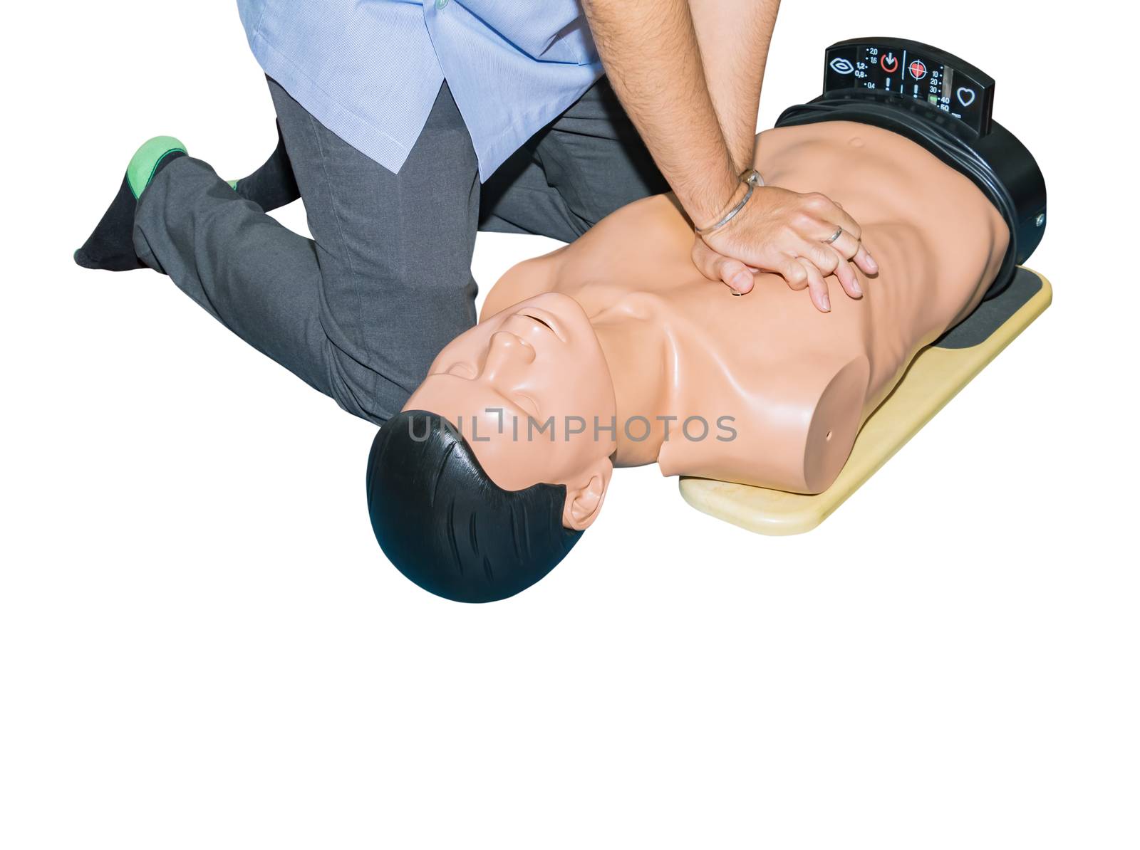 CPR aid dummy medical training with hand press Heart on doll emergency refresher training Concept closed-up. isolated on white background