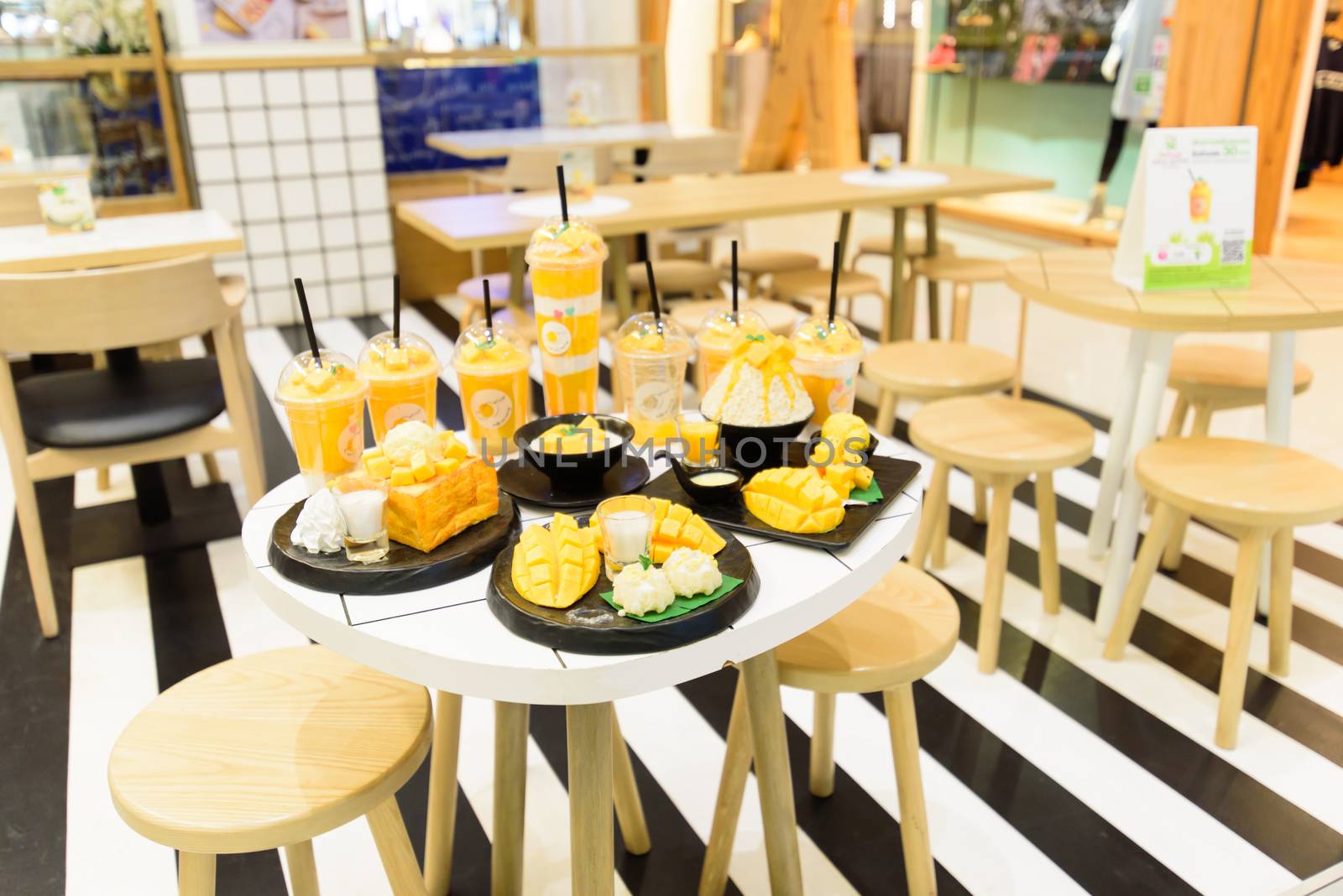 Mockup model of Mango Juice menu in the table of Make Me Mango shop in Centralworld by rukawajung