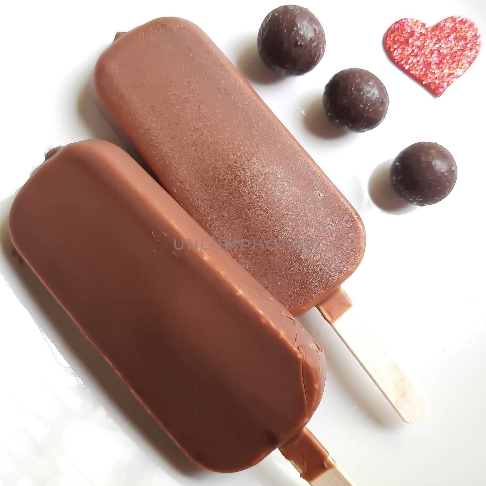 Delicious two chocolate icecream bar with chocolate ball in white plate plated beautifully