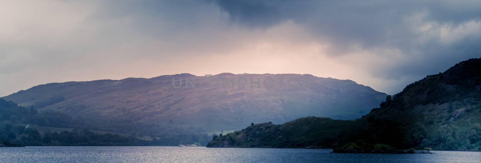 view of stormy skies north east across ullswater from glenridding